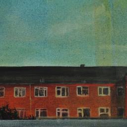 Red brick houses from train window